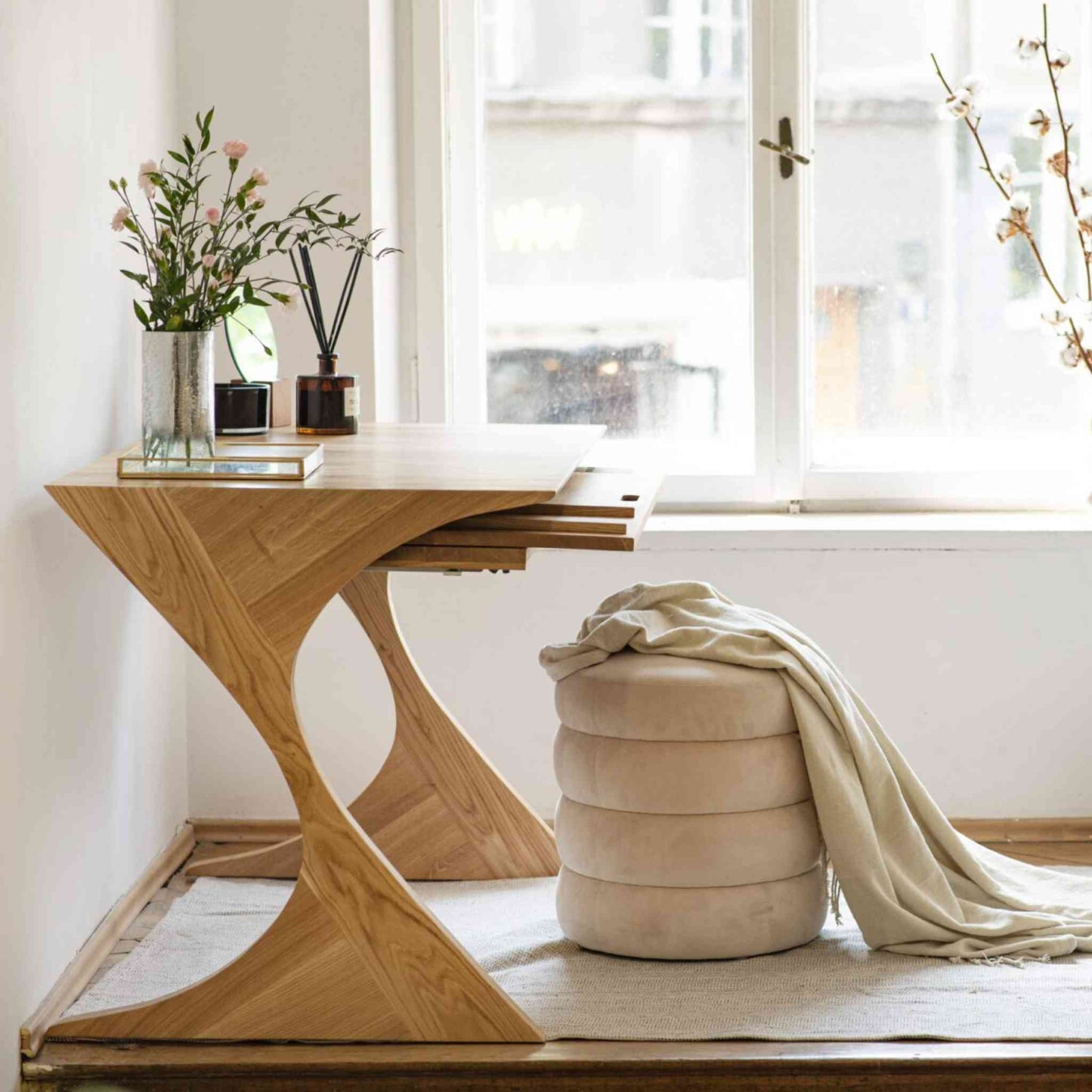Interior arrangement with the Cervin Desk with a unique hourglass shape in solid oak wood
