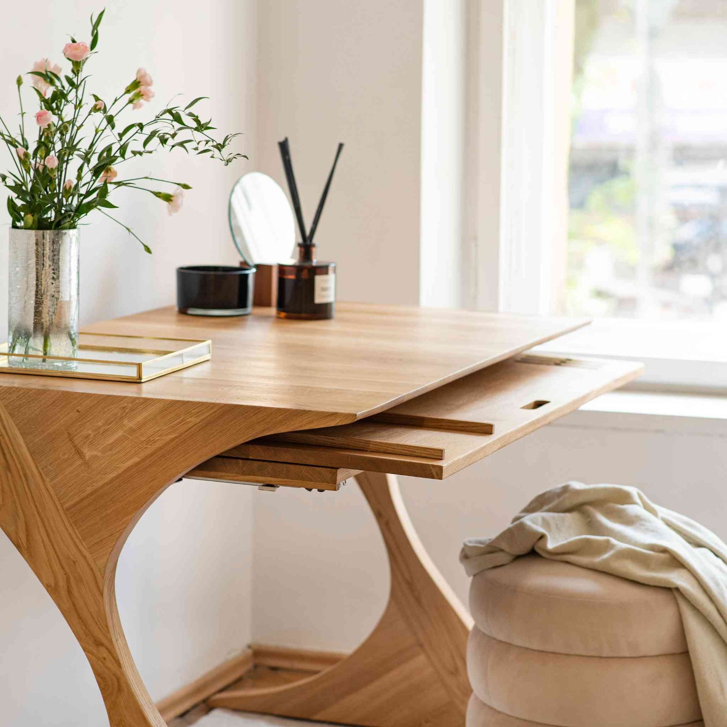 Interior arrangement with the Cervin Desk with a unique hourglass shape in solid oak wood