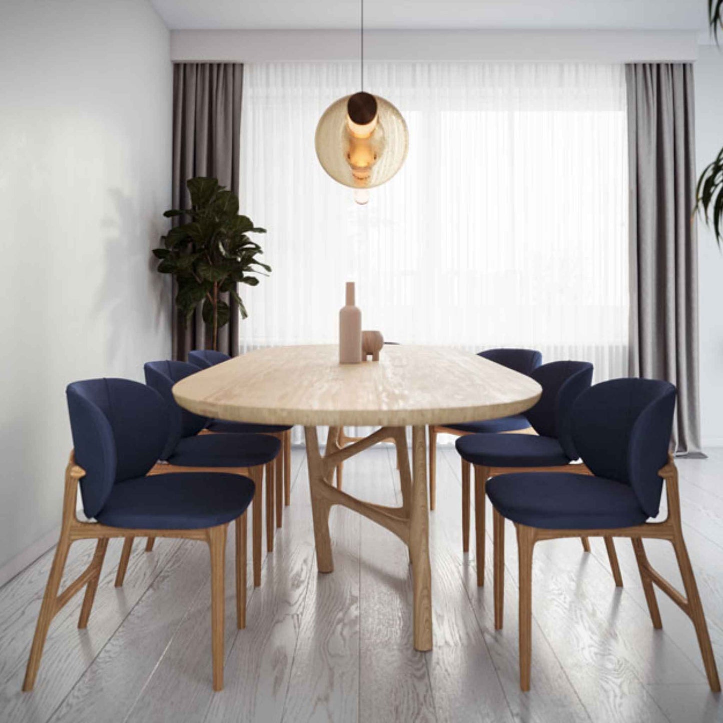 Interior setting with chairs and the Oval Dom table with a beautiful base, made from solid oak wood
