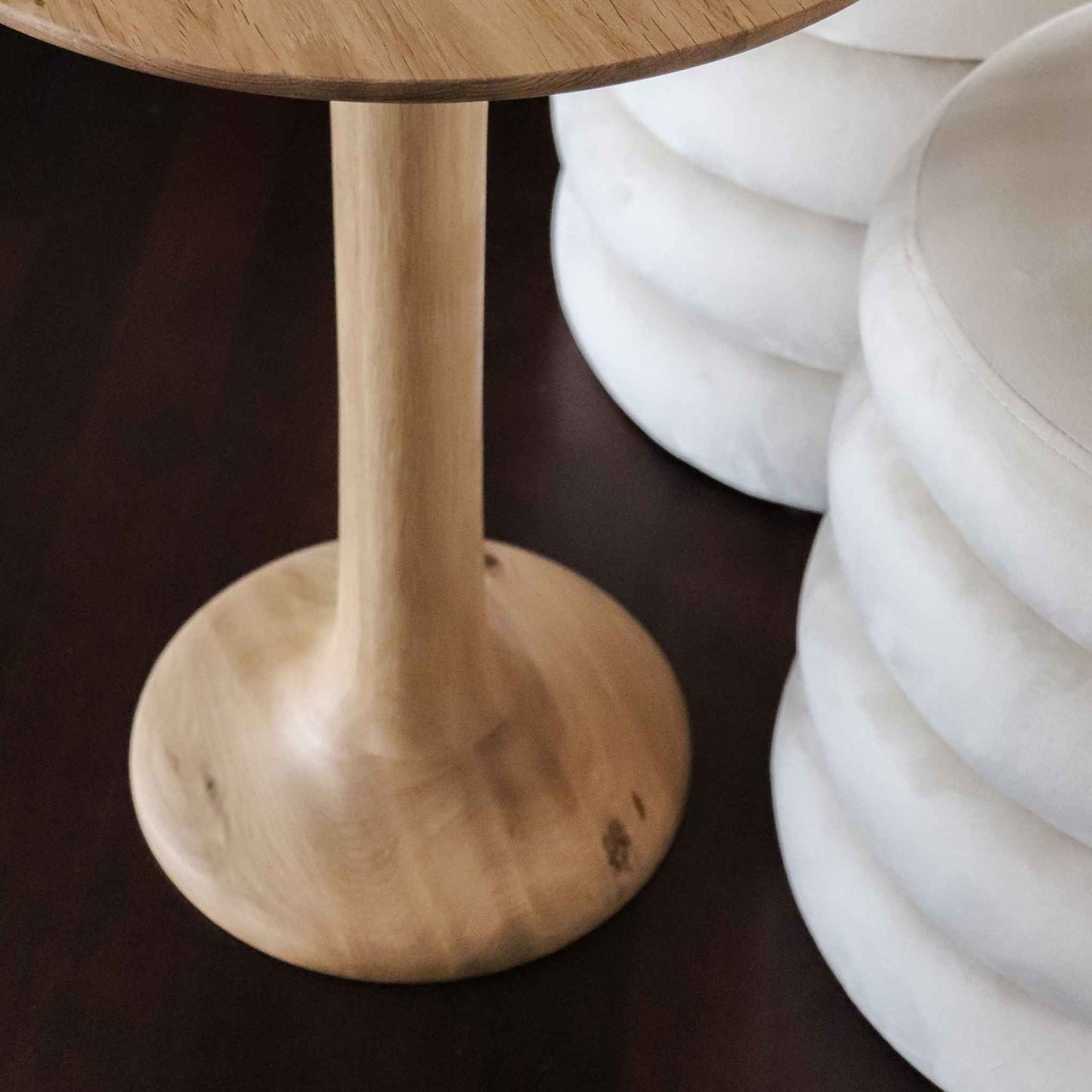 Base detail of the ÉTAUDORÉ Lianna side table crafted from solid oak wood