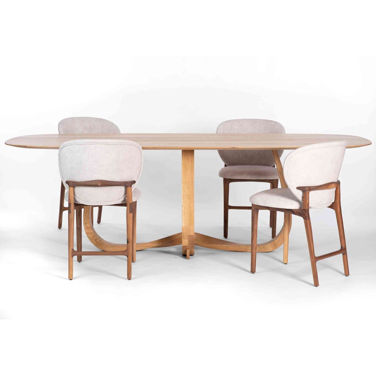 Interior arrangement with the Oval Eiger Solid Oak Wood Table with a beautiful intertwined loop base and Uetliberg chairs