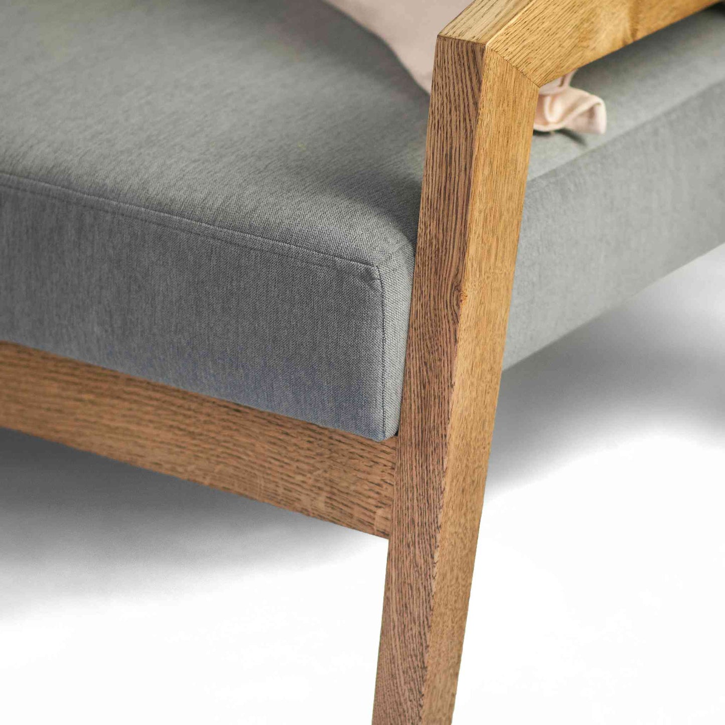 Piz Gloria solid oak wood sofa with high quality fabric upholstery in ash gray color - detail view