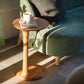 ÉTAUDORÉ Albula Side Table styled beside a sofa with a cup and book on top