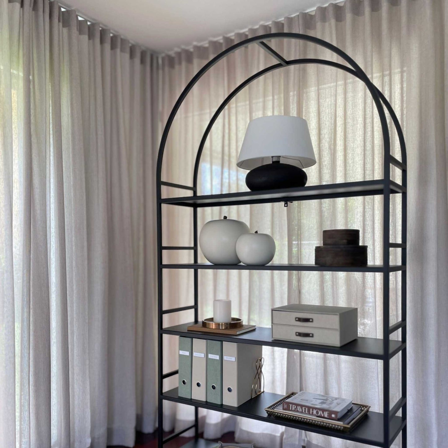 Arched Arkada 03 bookcase at the ÉTAUDORÉ live-in showroom in Thalwil