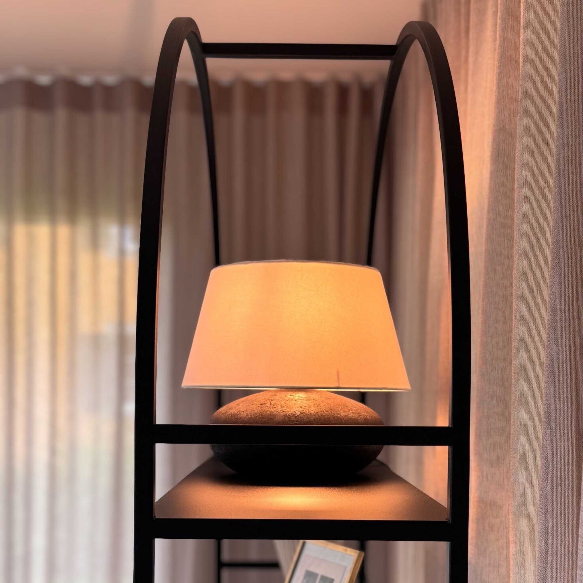 Arched Arkada 03 bookcase at the ÉTAUDORÉ live-in showroom in Thalwil