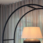 Arched Arkada 03 bookcase at the ÉTAUDORÉ live-in showroom in Thalwil