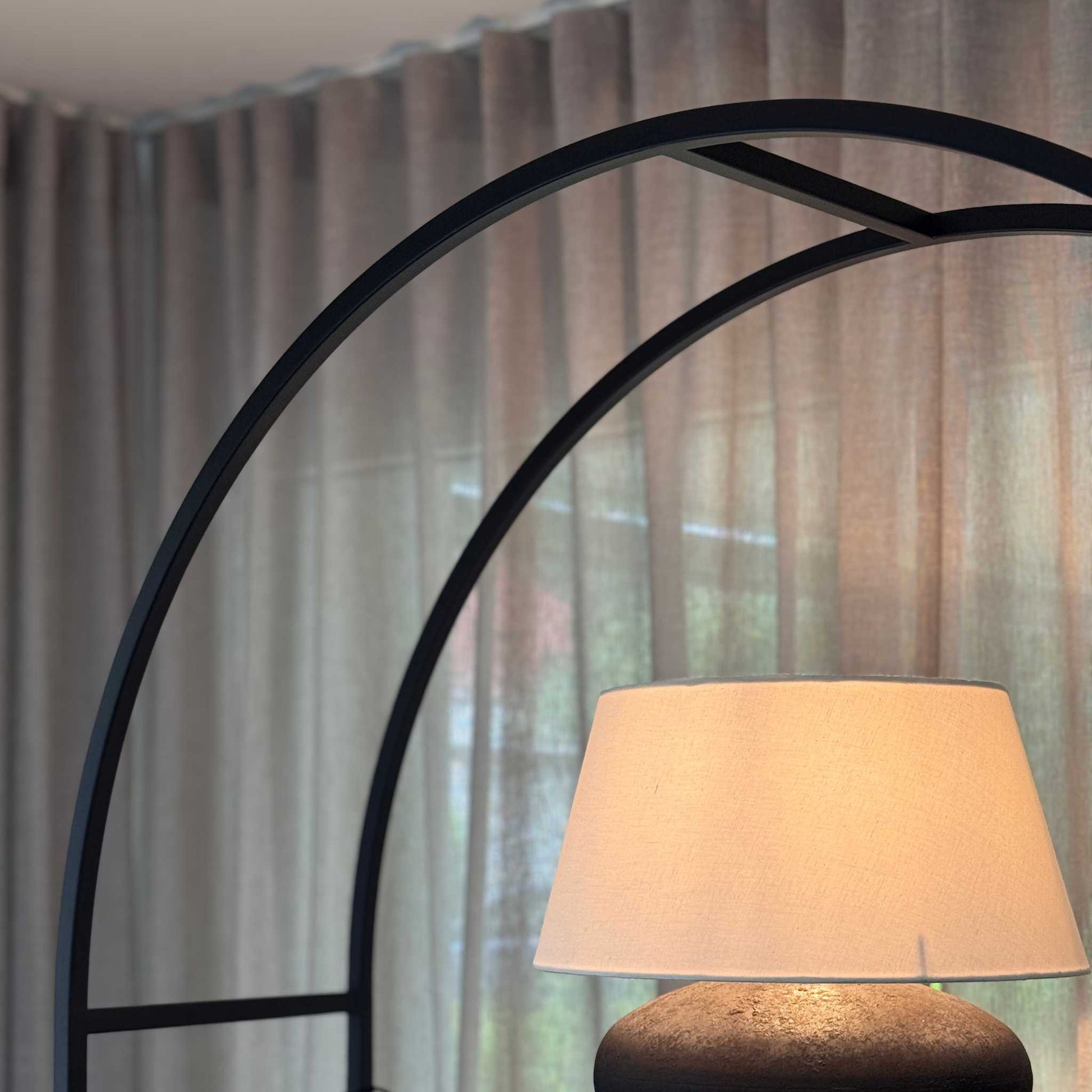 Arched Arkada 03 bookcase at the ÉTAUDORÉ live-in showroom in Thalwil
