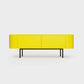 Curved Desiva Enna 01 lowboard in lemon yellow color steel, available in Switzerland via ÉTAUDORÉ