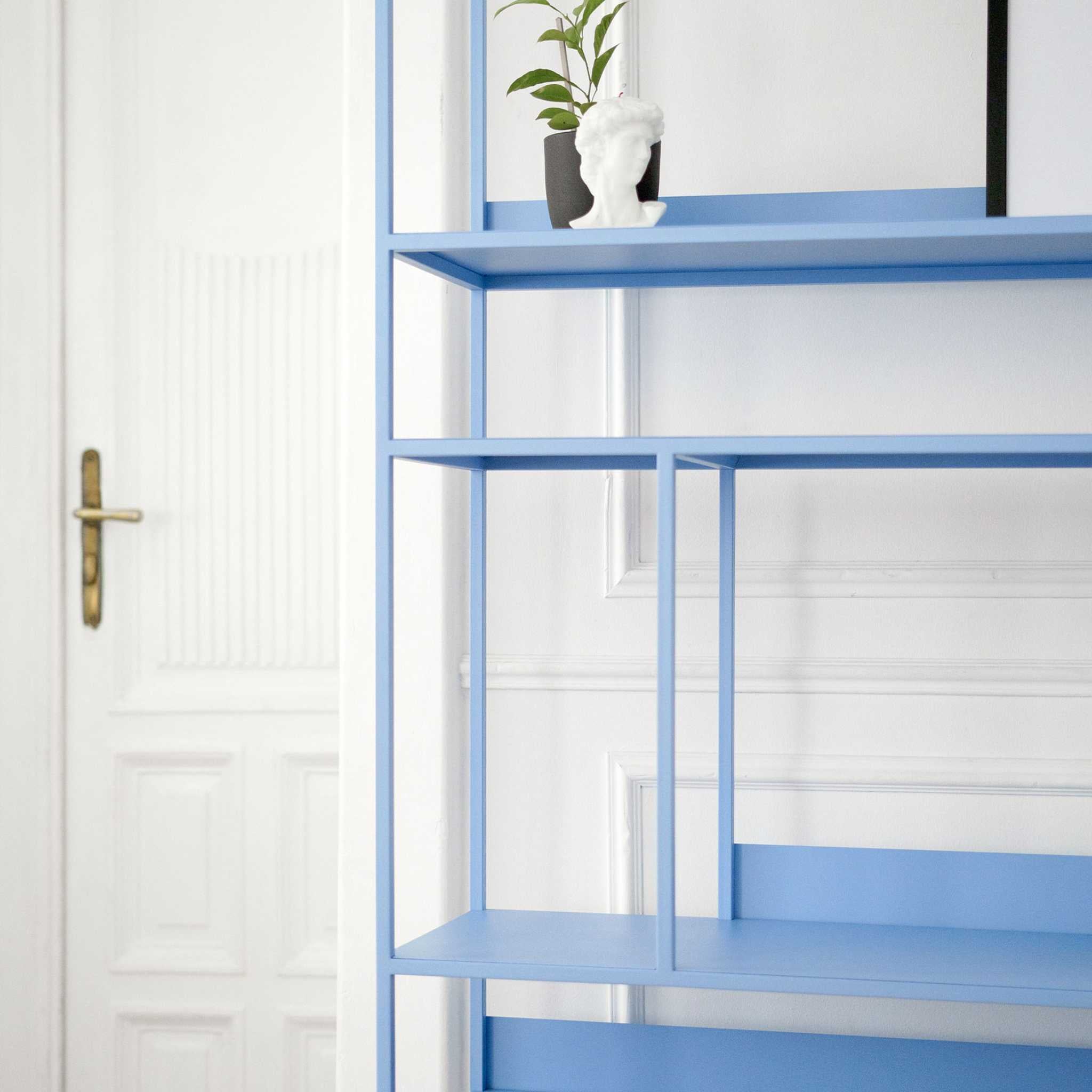 Detail of the ÉTAUDORÉ Floks 01 powder coated steel bookcase in sky blue