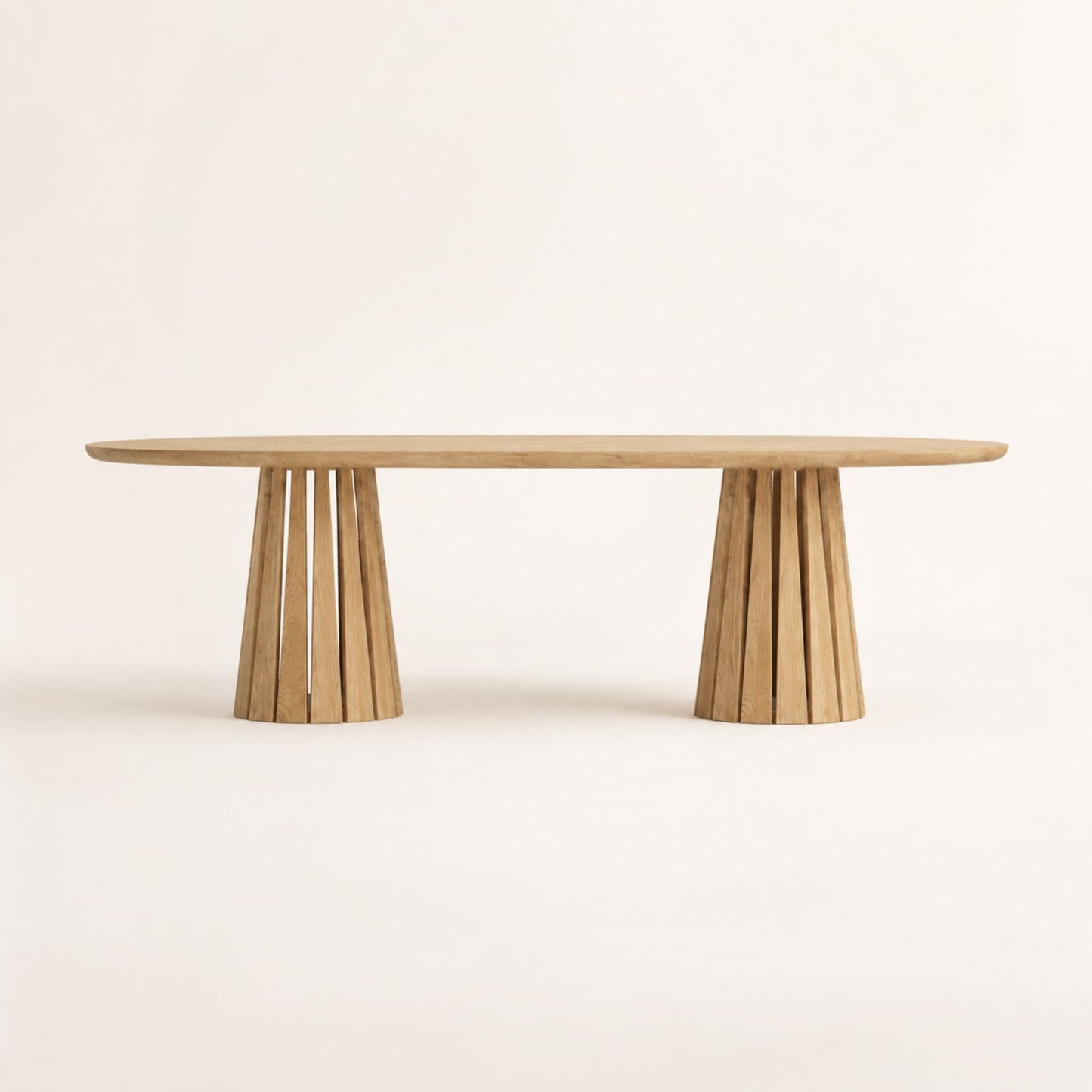 Front view of the ÉTAUDORÉ Noemi Rounded Oval Table in solid oak wood, designed in collaboration with Noemi Gwalter Rubino