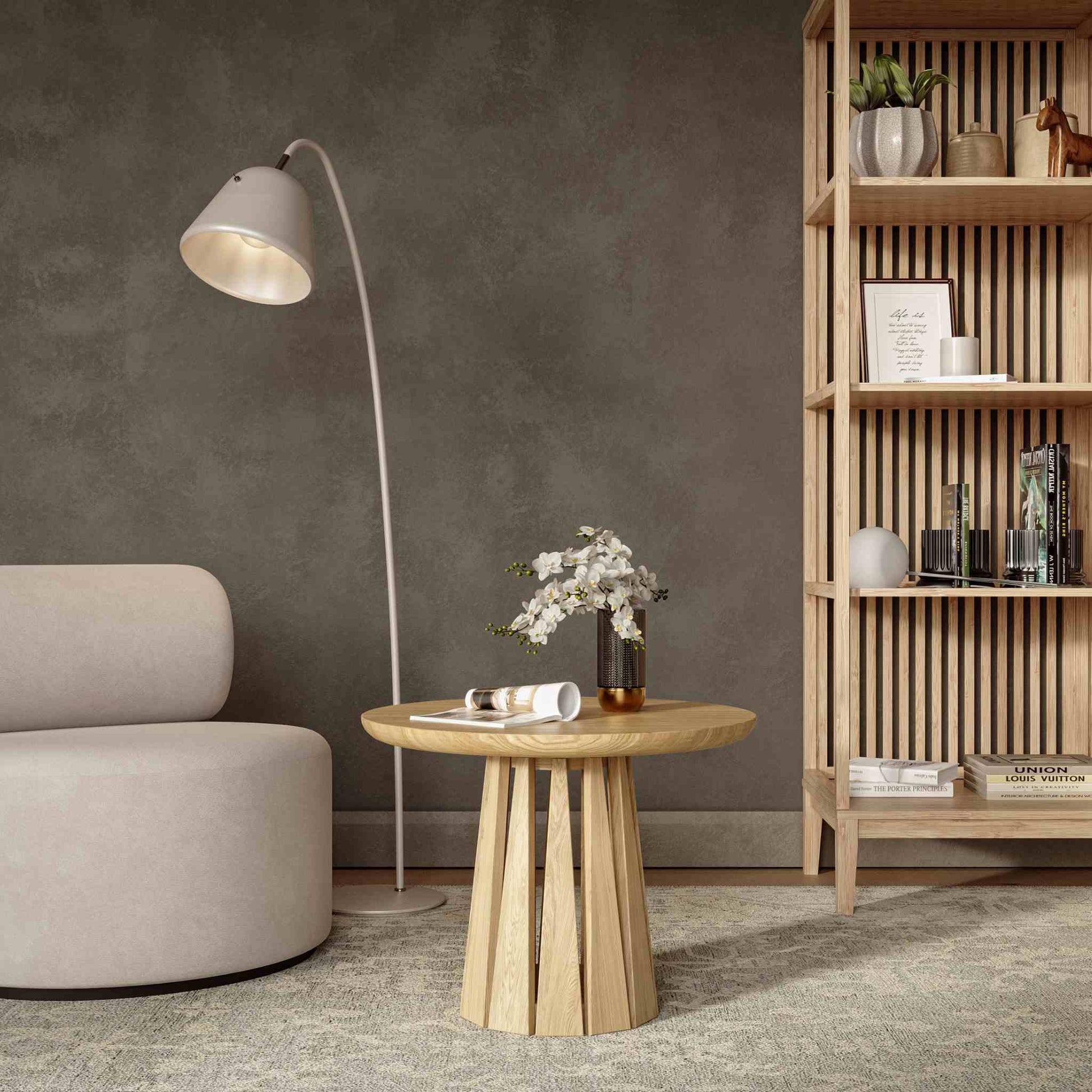 Interior arrangement with the Round Rigi Coffee Table in solid oak wood with a beautiful base