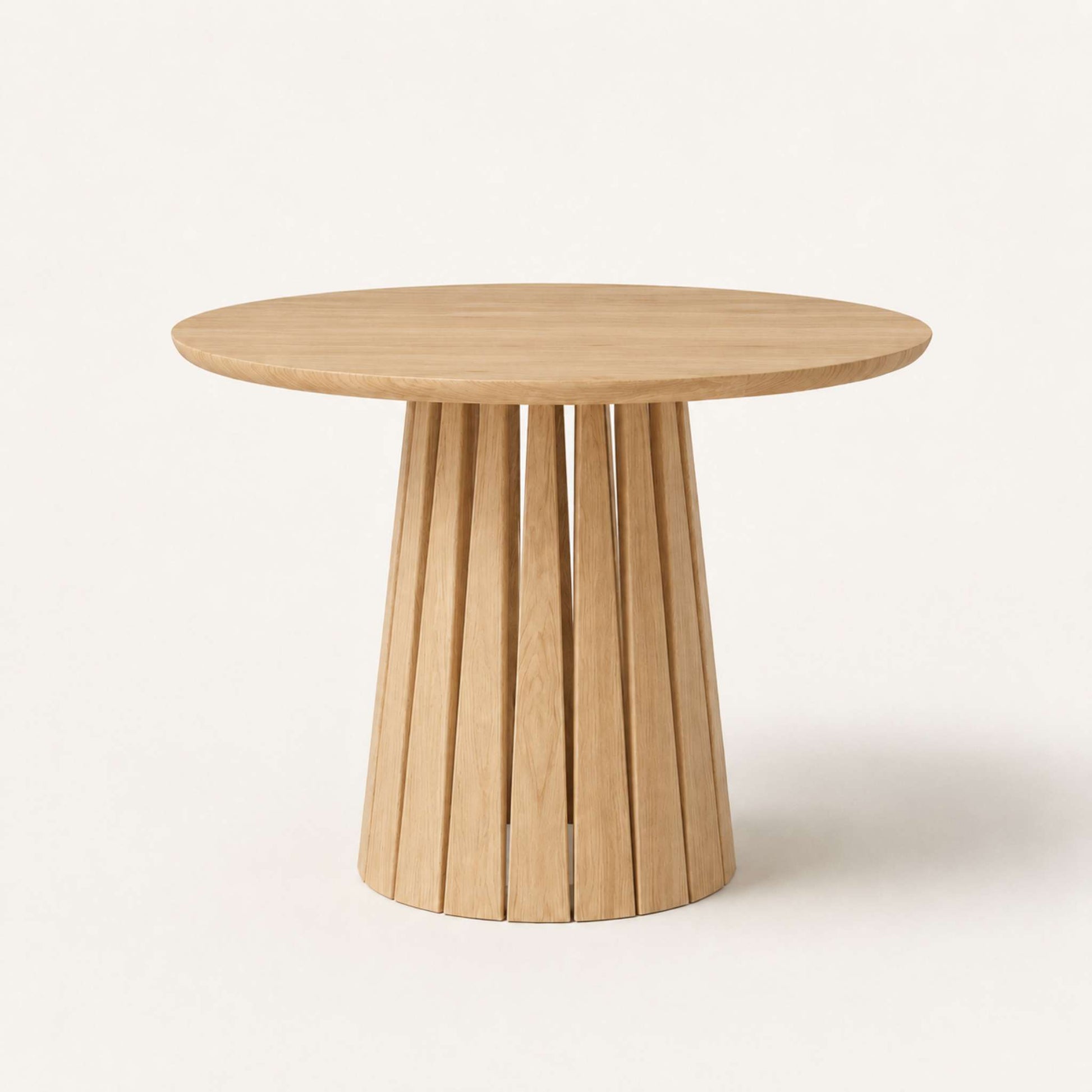 Round Rigi table from ÉTAUDORÉ in solid oak wood with a beautiful base in a natural finish