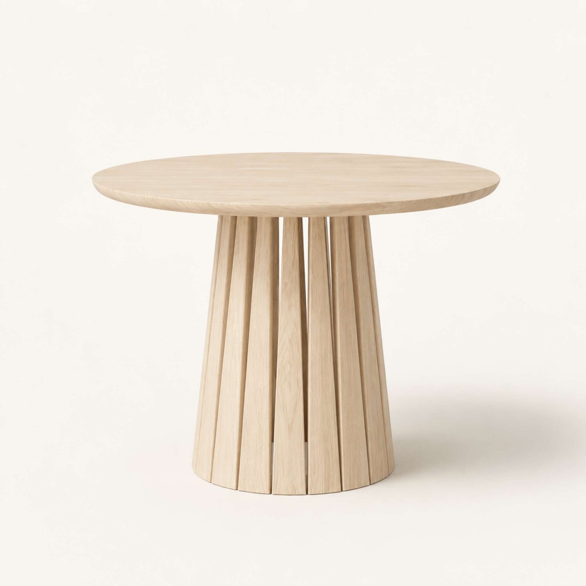 Round Rigi table from ÉTAUDORÉ in solid oak wood with a beautiful base in a whitewashed finish