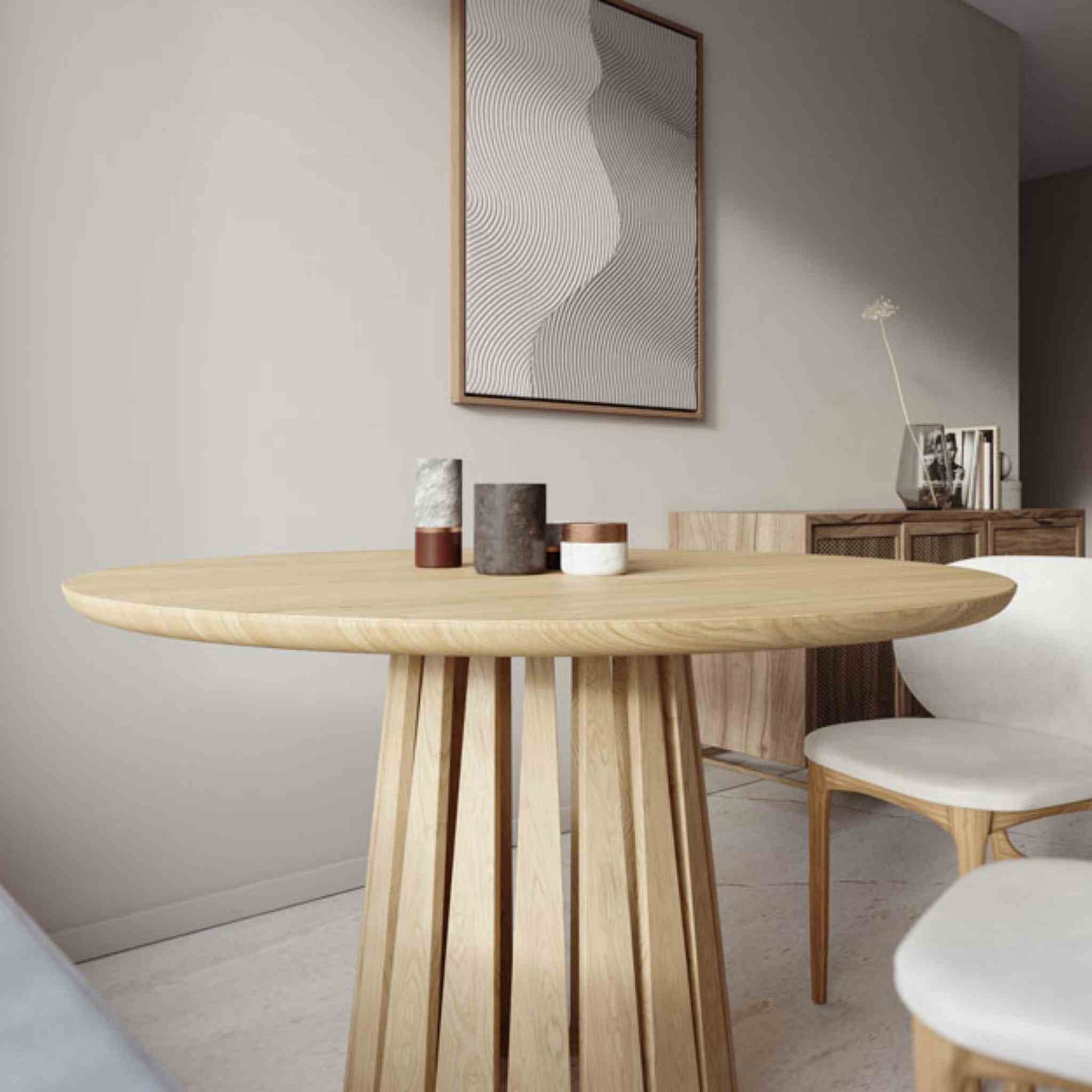 Interior arrangement with the Round Rigi table from ÉTAUDORÉ in solid oak wood with a beautiful base